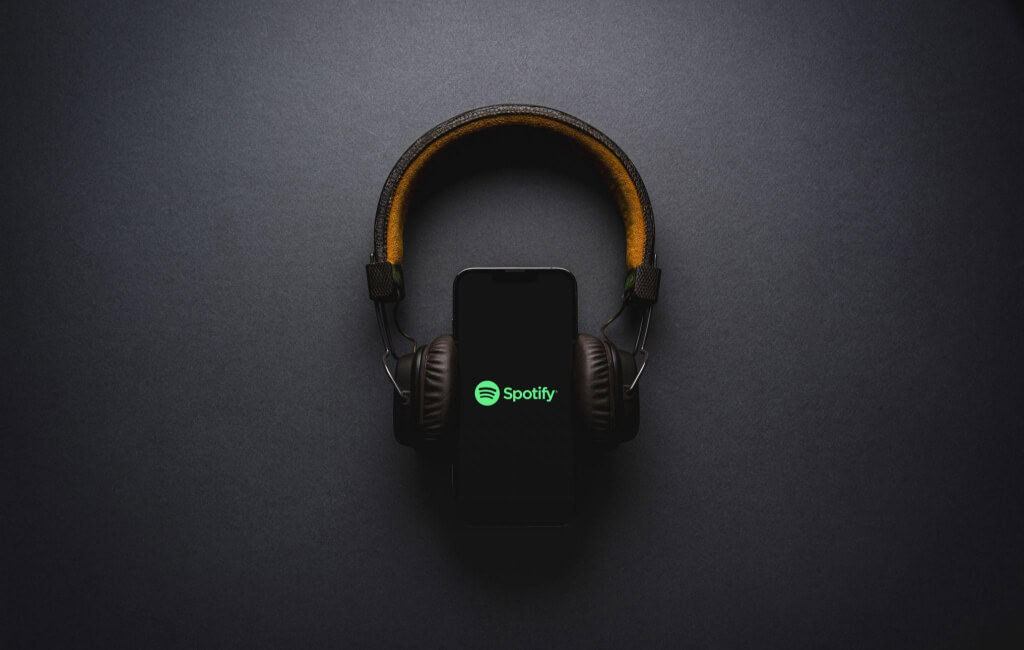 Headphones over the Spotify logo | Spotify’s North Star Metric