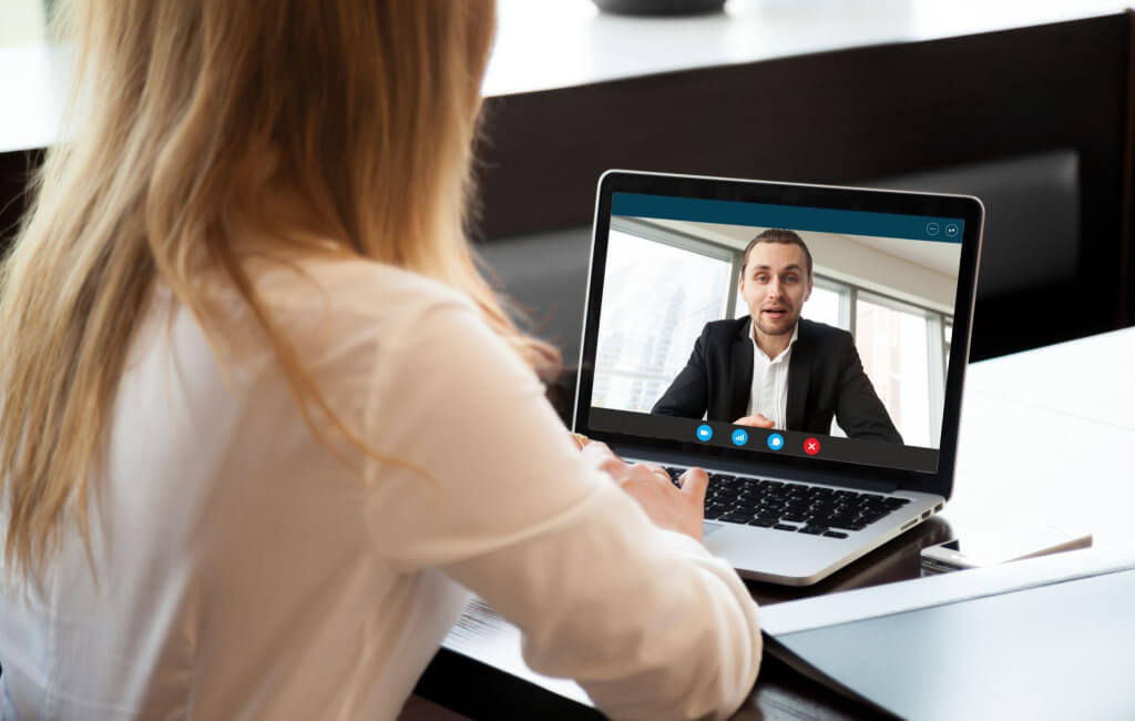 Woman in online meeting | On-page SEO vs. technical SEO