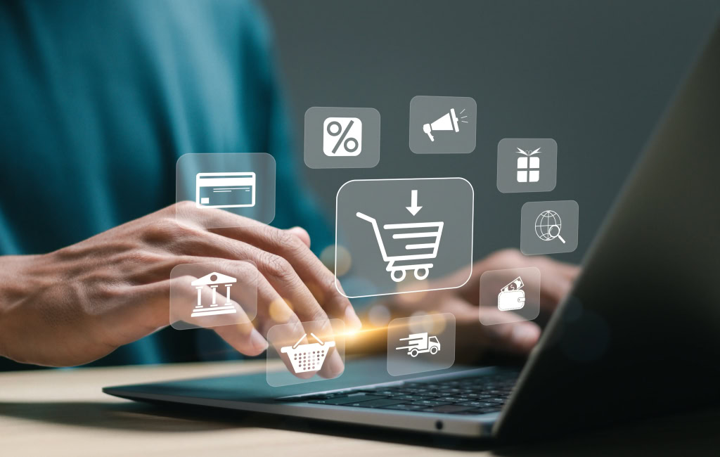 Ecommerce icons floating above laptop | Ecommerce marketing strategies