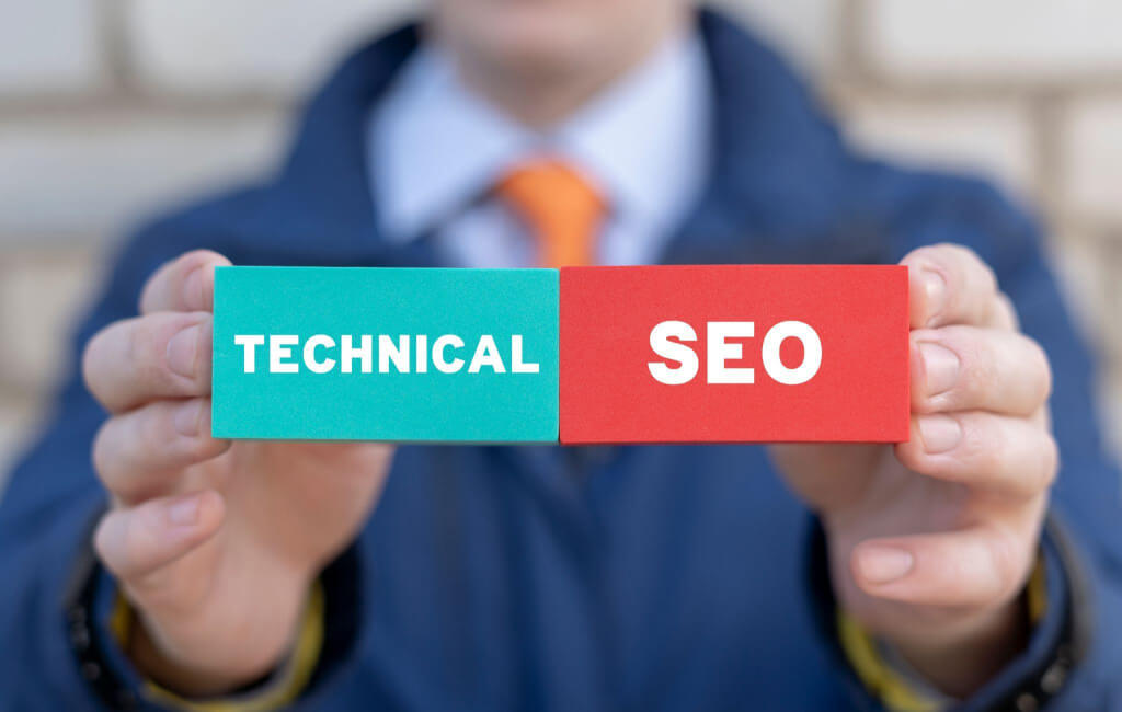 Man holding block saying technical SEO | On-page SEO vs. technical SEO