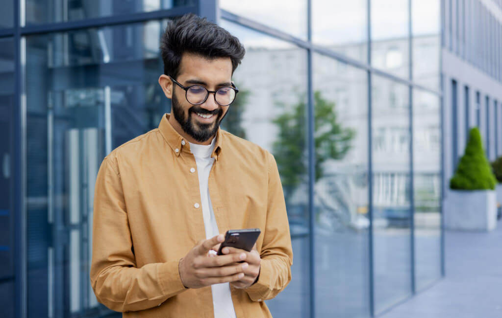 Man using his phone | On-Page SEO issues