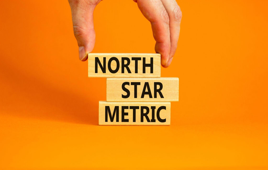 Three wooden blocks spelling “North Star Metric” | Uber’s North Star Metric