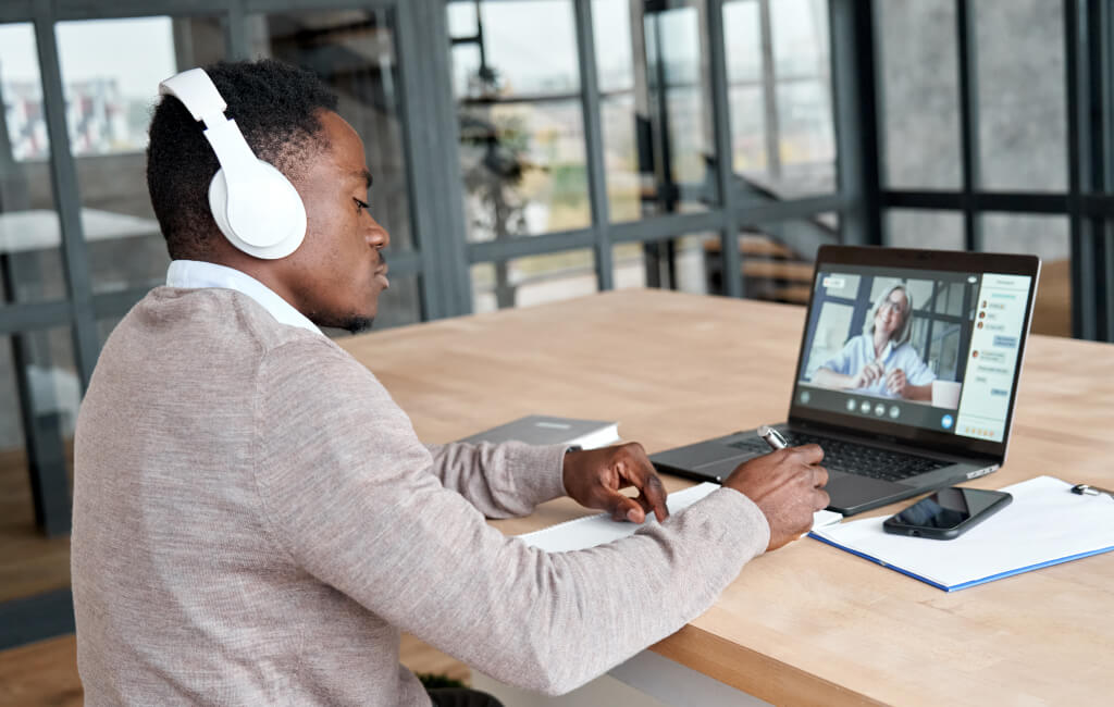 Man in an online meeting | SEO vs. PPC