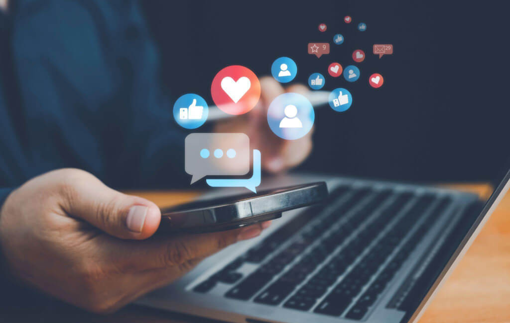 Social media icons over phone | Why is mobile advertising important? 