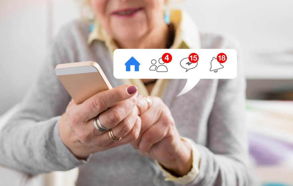 Old woman with Facebook notifications on her phone | Automate Facebook ads