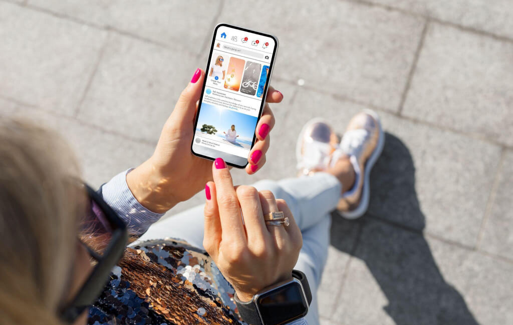 Woman using social media | Automate Facebook ads