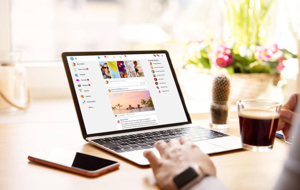 Person browsing Facebook on a laptop | Automate Facebook ads