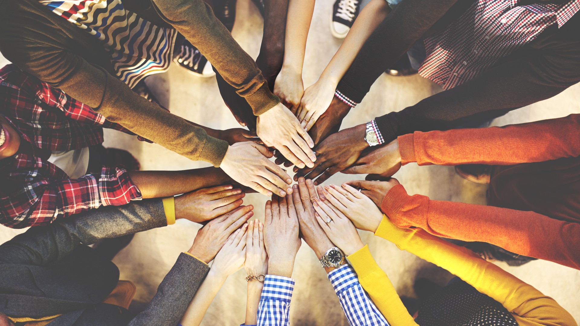 Group of Hands Making a Huddle | Benefits of a North Star Metric | Teknicks