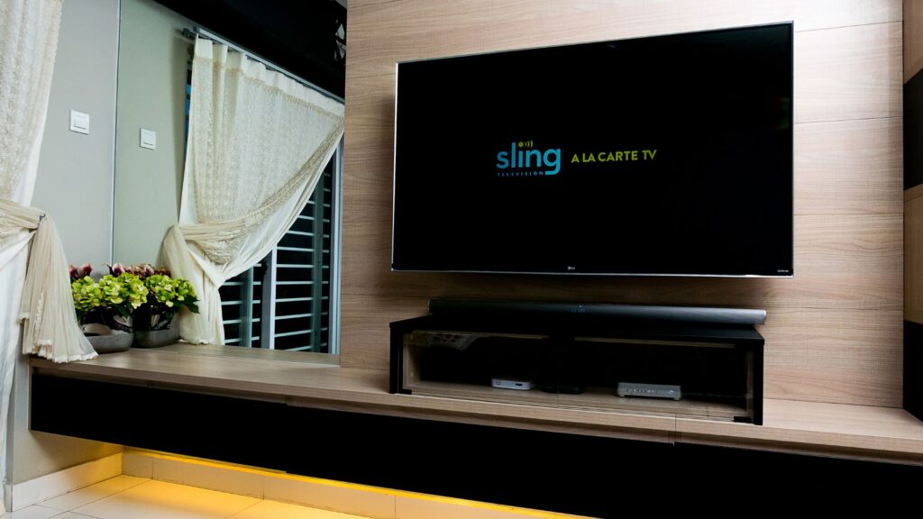 TV displays Sling logo as app launches | Monetization and Pricing Strategies for Streaming Companies