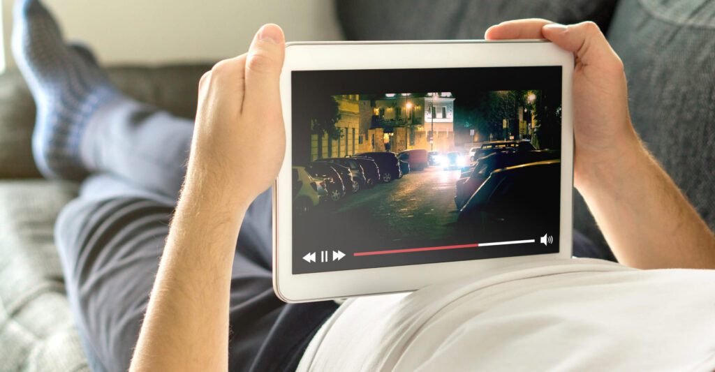 Person watching Netflix on tablet |Netflix’s North Star metric