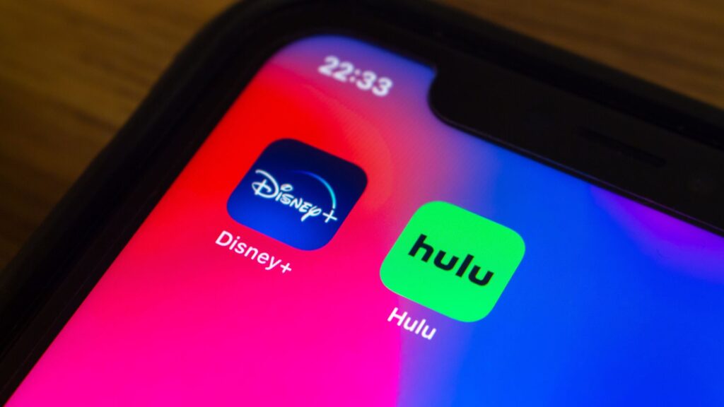 Close up of Disney+ and Hulu logos showing on iPhone | Embedding Network Effects