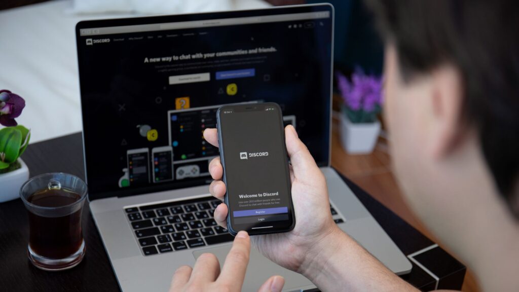 User launches Discord on smartphone while also viewing it on their laptop browser | Finding the Right SaaS Users