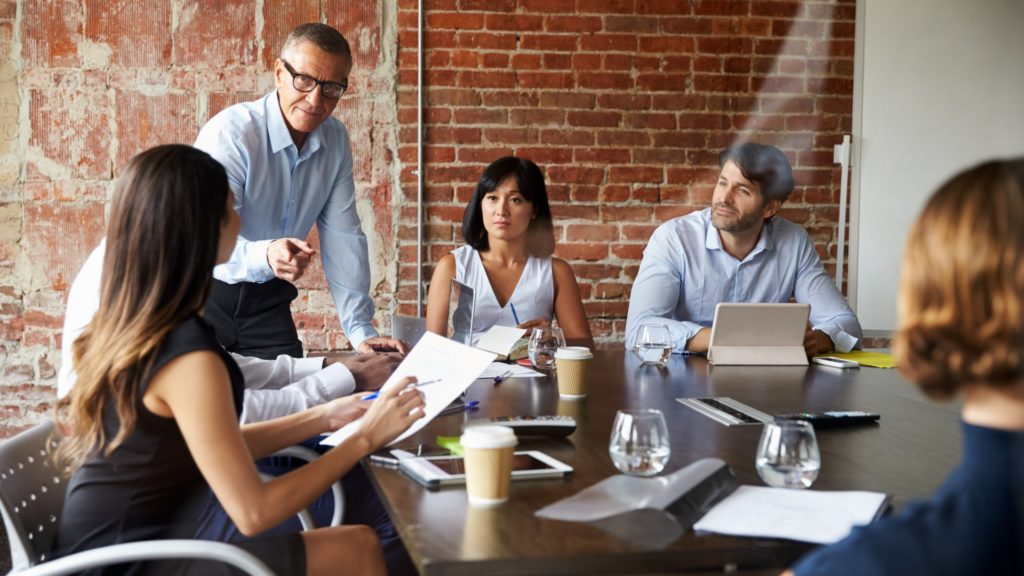 People Sitting in a Meeting | Understand the Relevant Traits of Your Business | Teknicks